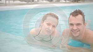 Hot spring geothermal spa. Romantic couple in love relaxing in hot pool.