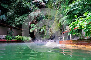 Hot spring surrounded by vegetation at Las Fuentes Georginas in Zunil, Guatemala