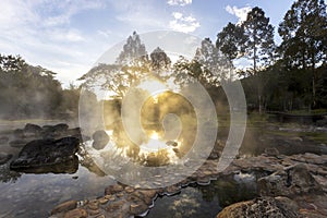 Hot springs and fog in Thailand with sunlight at morning