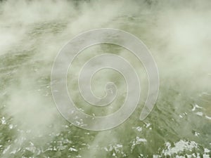 Hot steam on green waste water texture