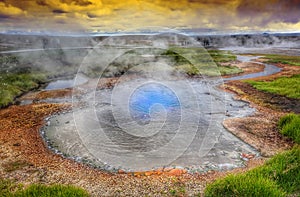 Hot steam over the source of the thermal waters, Hveravellir, Iceland. White nights in Iceland.