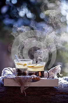 Hot steaming lemon tea outdoors