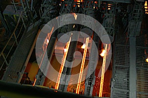 Hot steel in continuous casting machine.