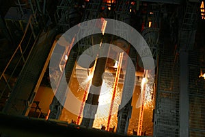 Hot steel in continuous casting machine.