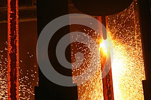 Hot steel in continuous casting machine.