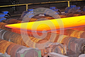 Hot steel on conveyor