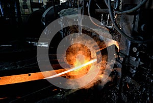 Hot steel on conveyor photo