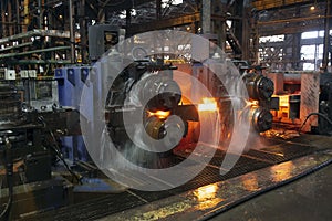 Hot steel on conveyor in a steel mill. hot rolled rebar