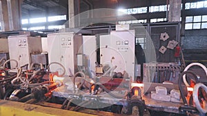 Hot steel pipe production line. Red hot metal pipe production process. Metallurgy. Hot Metal Tubes. Work Heavy Industry