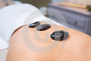 hot stone on back womans
