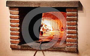 Hot stone oven while cooking bread and italian pizza