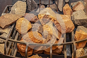 Hot stones in the steam room in the Finnish sauna close-up. Spa for relaxation and relaxation