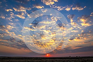 Hot summer sunset in the clouds