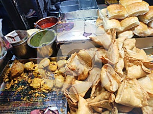 Hot tastey Indian Street food samosa and vada pav selling food