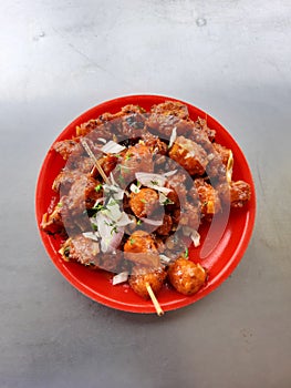 Hot and tasty Indian Gobi Manchurian snacks in a plate