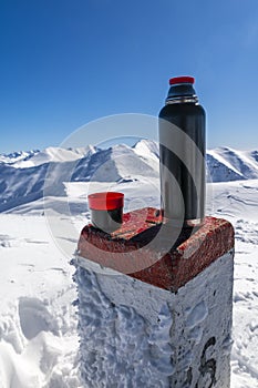 Hot tea adds vigor in the winter in the mountains. Hot tea adds vigor when hiking in the winter in the mountains.