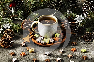 Hot tea with Christmas cookies, star and snowman shape.