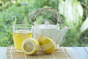 Hot tea cup with lemon and Teapot