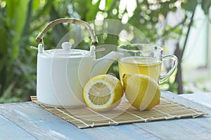 Hot tea cup with lemon and Teapot