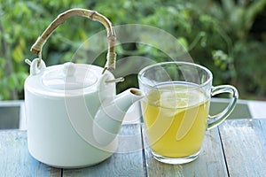 Hot tea cup with lemon and Teapot