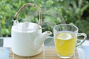 Hot tea cup with lemon and Teapot