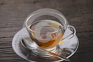 Hot tea cup on old wooden