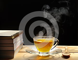 Hot tea cup on wood winter day black background.Tea time. Copy space. hot drink.