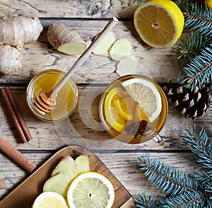 Hot tea with lemon, honey, ginger and anise. Healthy drink. winter beverage concept.