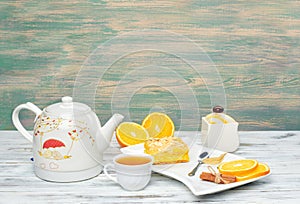 Hot tea with a mug spoon oops orange slices and sugar. Cozy home tea concept