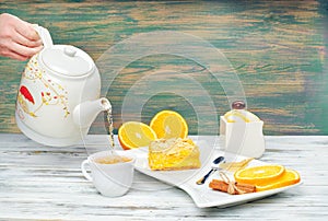 Hot tea with a mug spoon oops orange slices and sugar. Cozy home tea concept