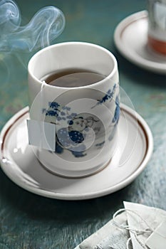 Hot tea on an old chinese tea cup