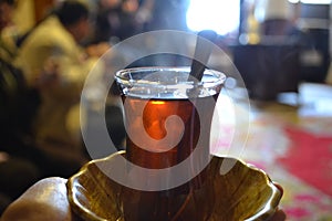 Hot tea in turkish small glass photo