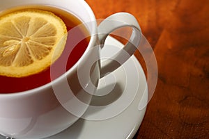 Hot teacup with lemon and sugar