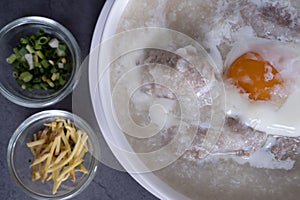 Hot Thai congee (rice porridge) with minced pork ball and boiled egg as breakfast