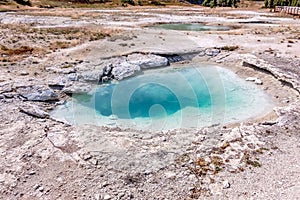 Hot thermal spring Abyss Pool in Yellowstone National Park, West Thumb Geyser Basin area, Wyoming, USA