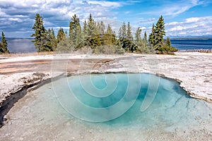 Hot thermal spring Abyss Pool in Yellowstone National Park, West Thumb Geyser Basin area, Wyoming, USA