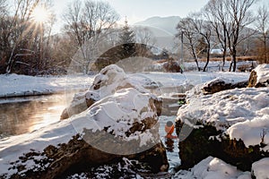 Hot thermal spring and snowy winter day in village Liptovsky Jan in Slovakia