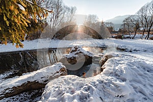 Hot thermal spring and snowy winter day in village Liptovsky Jan in Slovakia