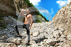 Hot Thirsty Man Drinking Water Drink After Running Outdoors. Sport