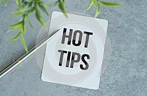 Hot tip text on white paper on the wood table