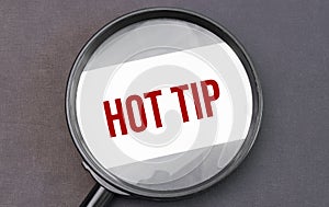 Hot tip word on paper through magnifying lens