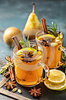 Hot Toddy. Mulled pear cider or spiced tea or grog photo