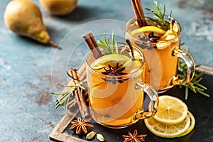 Hot Toddy. Mulled pear cider or spiced tea or grog photo