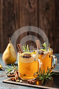 Hot Toddy. Mulled pear cider or spiced tea or grog photo