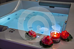 Hot tub with candles and water lilies