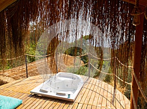 Hot tub in the hotel room suite balcony with sea view. Summer day honeymoon romantic luxury resort vacation place