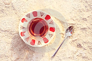 Hot turkish tea outdoors near water. Turkish tea and traditional