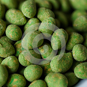 Hot Wasabi Peanuts. Wasabi coated peanuts close-up. Green spicy Japanese snack