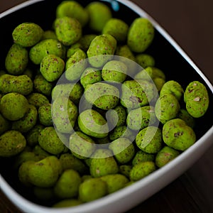 Hot Wasabi Peanuts. Wasabi coated peanuts close-up. Green spicy Japanese snack