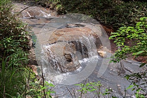Hot water of the Oyunumagawa river flowing from the Oyunuma pond through Hell Valley Jigokudani